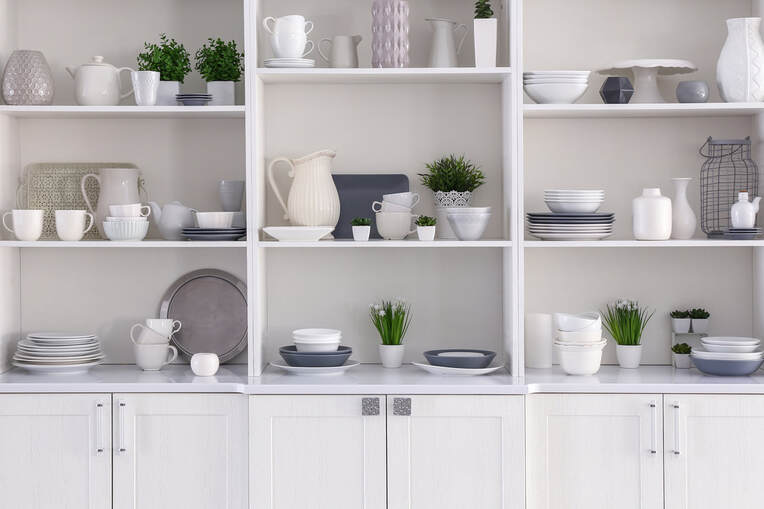 Organized kitchen shelving with color coordinated decor