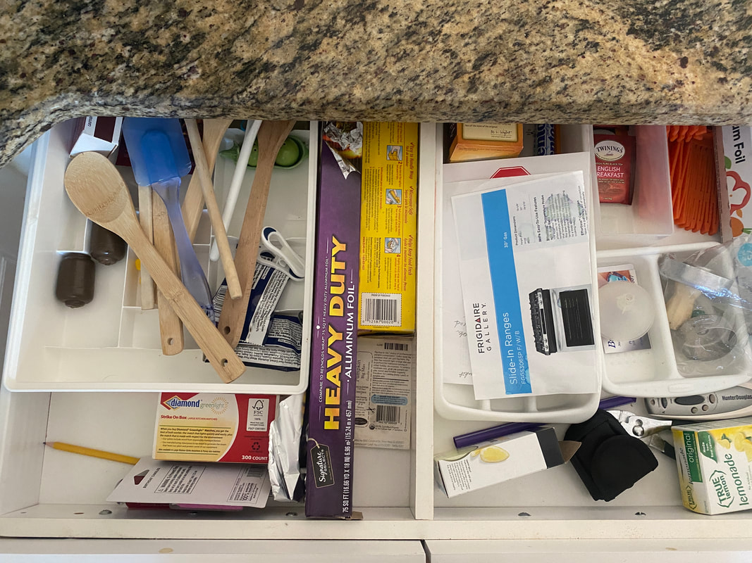 cluttered kitchen drawer