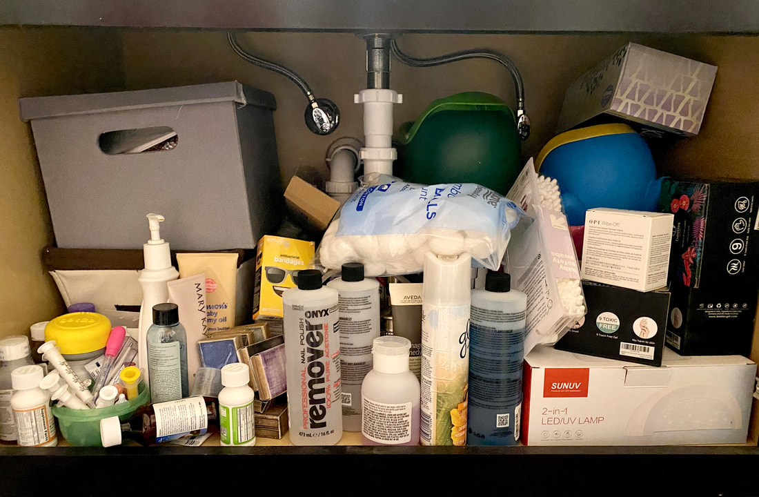 Cluttered disorganized cabinet