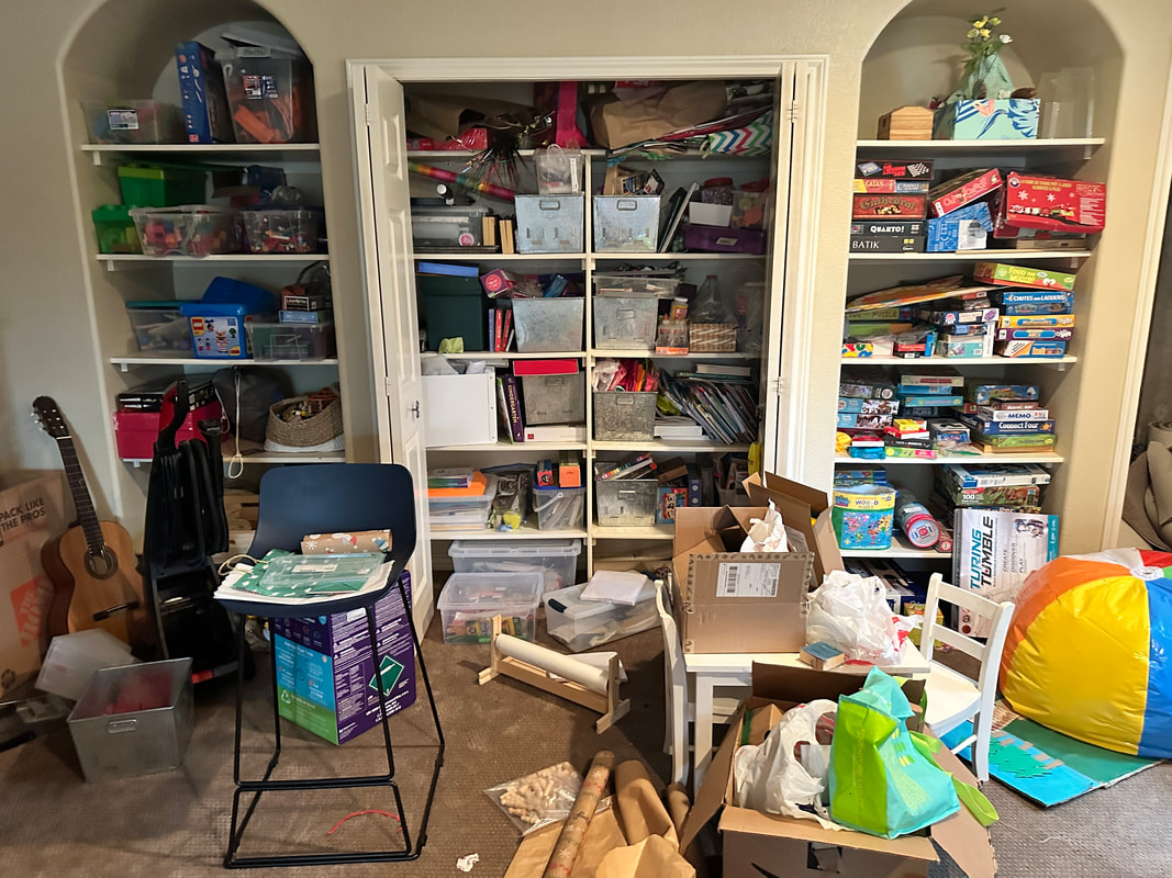 Overflowing and cluttered craft storage area